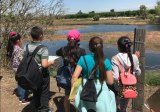 A group of school-age youths visit the Burris Park Outdoor Education Program. The Burris Park Foundation and Kings educators welcomed naturalist Jean Goulart to the program.
